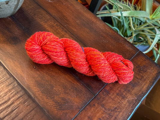 Red handspun yarn: 2-ply Corriedale wool, “Aziraphale”